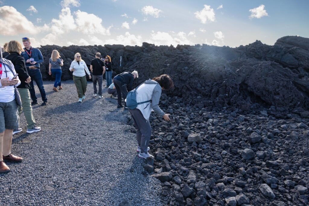 People taking lava souvenirs